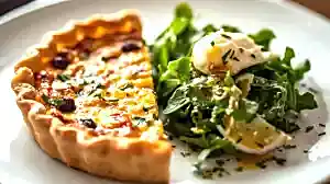 seasonal quiche, served with mixed salad and homemade beauty sauce, served on a plate
